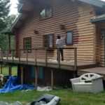 Wildwood Log Home Restoration chinking and staining on a pacific northwest log home.