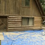 New-age glass media blasting exterior log home restoration.