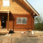 Exterior log home staining in Washington by Wildwood Log Home Restoration