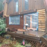 Exterior log home stain with Perma-Chink staying by Wildwood Log Home Restoration