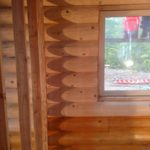 Interior log staining on a new home in Washington state by Wildwood Log Home Restoration.