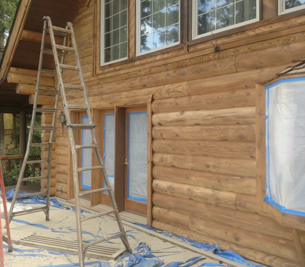 Log home glass media blasted by wild wood log home restoration revealing natural wood grain.