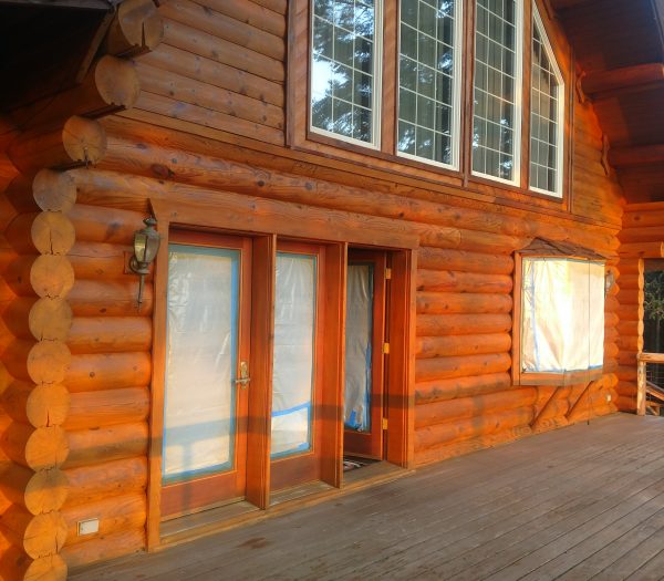 Log cabin in Washington state restored by wild wood log home restoration.